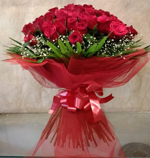 Bouquet of 50 Red Rose in Net Packing delivery in Bhopal