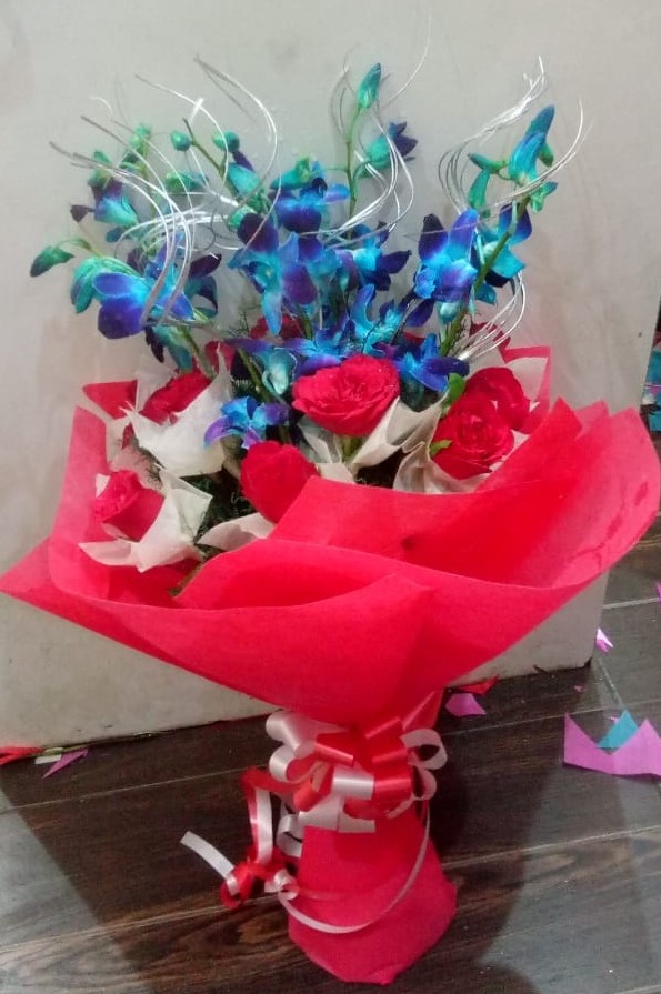 Flowers Delivery in IndoreRed Roses & Blue Orchid in Paper Wrapping