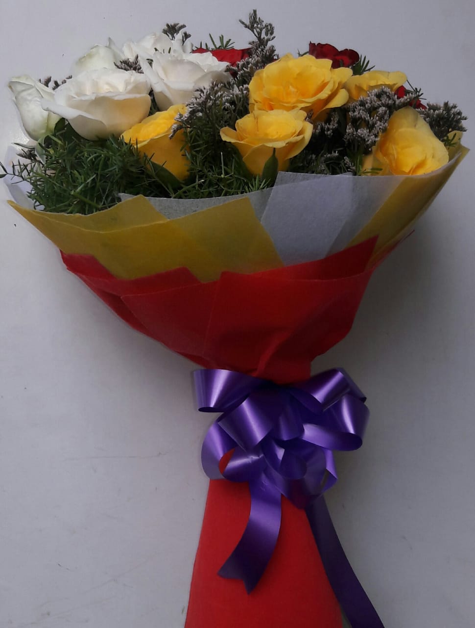 Flowers Delivery in RanchiMix Roses in Multi Paper