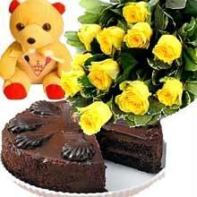 A bunch of 12 Roses with 1/2 kg Chocolate Cake and a cute Teddy